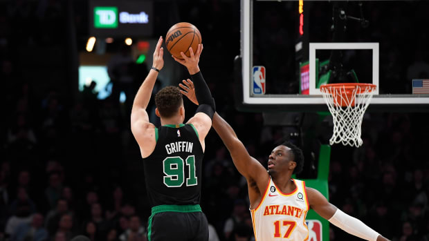 Boston Celtics forward Blake Griffin shoots the ball over Atlanta Hawks forward Onyeka Okongwu.