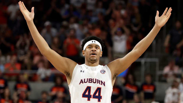 Auburn center Dylan Cardwell (44) reacts after a score against South Carolina during the first half of an NCAA college basketball game Saturday, March 5, 2022, in Auburn, Ala. (AP Photo/Butch Dill)