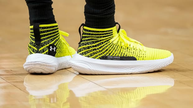 Atlanta Hawks guard Patty Mills' yellow and white Under Armour shoes.