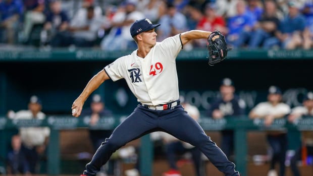 Jun 30, 2023; Arlington, Texas, USA; Texas relief pitcher Glenn Otto (49) throws a pitch during the ninth inning against the Houston Astros at Globe Life Field. Mandatory Credit: Andrew Dieb-USA TODAY Sports