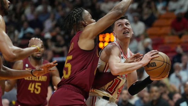 Mar 10, 2023; Miami, Florida, USA; Miami Heat guard Tyler Herro (14) looks to take a shot as Cleveland Cavaliers forward Isaac Okoro (35) defends in the first half at Miami-Dade Arena. Mandatory Credit: Jim Rassol-USA TODAY Sports