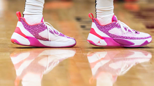 View of white and pink Jordan Luka shoes.