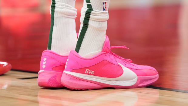 Milwaukee Bucks forward Giannis Antetokounmpo's pink and white Nike sneakers.