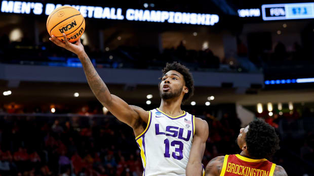 LSU Tigers forward Tari Eason (13) drives to the basket against Iowa State Cyclones guard Izaiah Brockington (1) in the first half during the first round of the 2022 NCAA Tournament at Fiserv Forum.