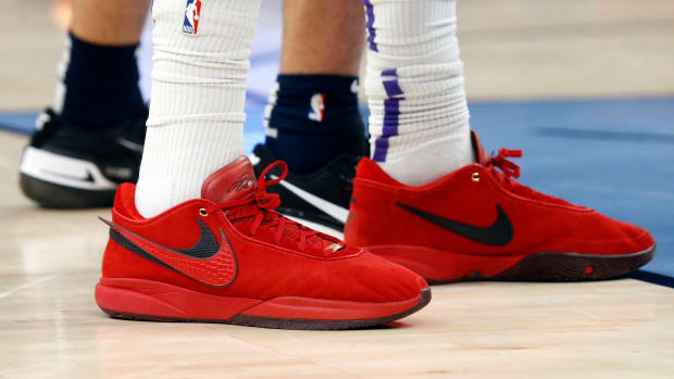 View of red and black Nike LeBron shoes.