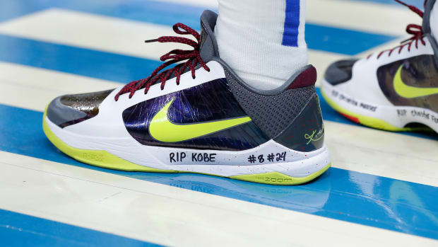 Dallas Mavericks guard Luka Doncic's yellow and white Nike Kobe shoes.