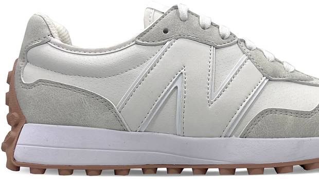 Side view of a white and grey New Balance golf shoe.