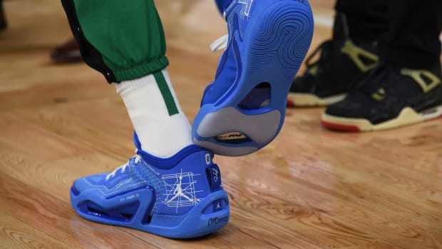 Boston Celtics forward Jayson Tatum's blue and white Jordan Brand sneakers.