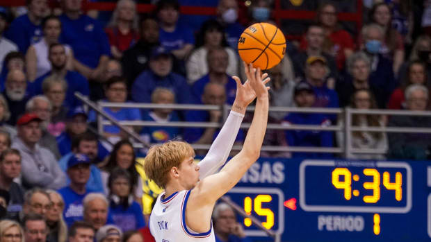 Jan 14, 2023; Lawrence, Kansas, USA; Kansas Jayhawks guard Gradey Dick (4) shoots a three point basket against the Iowa State Cyclones during the first half at Allen Fieldhouse.