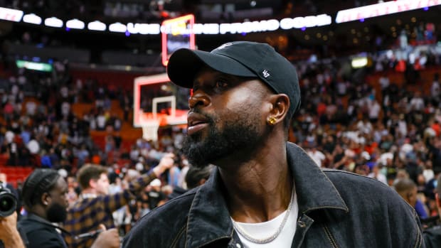 Mar 22, 2023; Miami, Florida, USA; Former Miami Heat player Dwyane Wade looks on after the game between the Miami Heat and New York Knicks at Miami-Dade Arena.