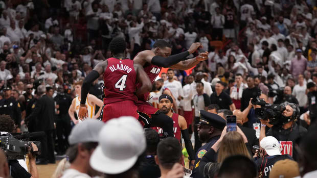 Apr 26, 2022; Miami, Florida, USA; Miami Heat center Bam Adebayo (13) and Miami Heat guard Victor Oladipo (4) celebrate after defeating the Atlanta Hawks in game five of the first round for the 2022 NBA playoffs at FTX Arena.