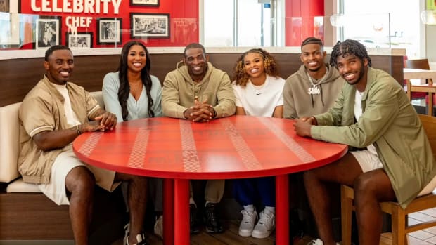 Deion Sanders enjoys sitting down with his family at Celebrity Chef