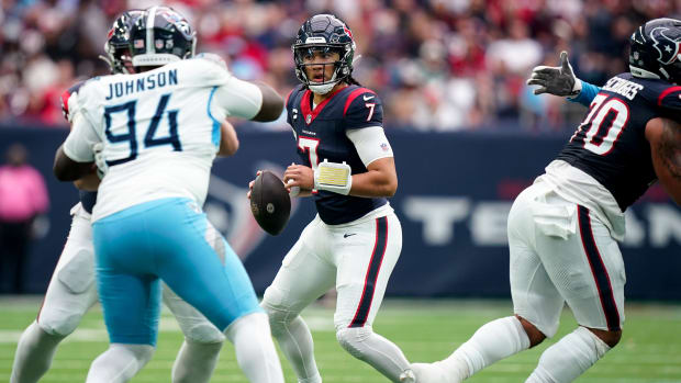 C.J. Stroud (7) looks for a receiver against the Tennessee Titans during the second quarter at NRG Stadium in Houston, Texas.