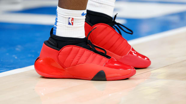 View of red and black Adidas shoes.