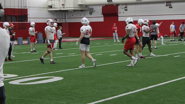 Hunter Wohler and Darryl Peterson walk between drills during practice.