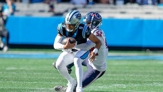 Panthers quarterback Bryce Young (9) is sacked by Houston Texans defensive end Jonathan Greenard (52) during the second half at Bank of America Stadium.