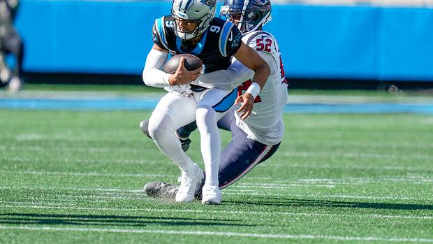 Panthers quarterback Bryce Young (9) is sacked by Houston Texans defensive end Jonathan Greenard (52) during the second half at Bank of America Stadium.