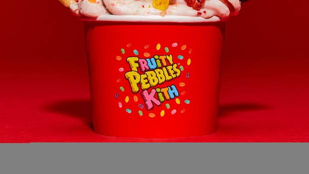 Ice cream topped with Fruity Pebbles cereal.