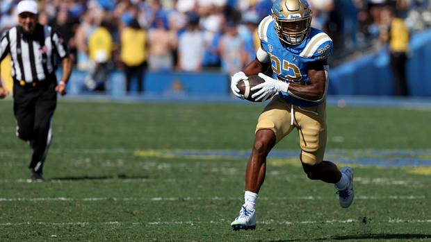 UCLA Bruins running back Keegan Jones carries the football.