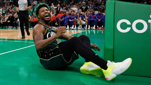 Marcus Smart smiles after being fouled.