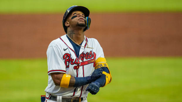 Atlanta Braves right fielder Ronald Acuna Jr. (13) celebrates like Trae Young after hitting a homer.