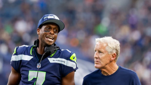 Geno Smith (left) and Pete Carroll