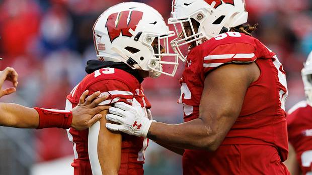 Wisconsin defensive players Rodas Johnson and Kamo'i Latu celebrate a big hit against Maryland.