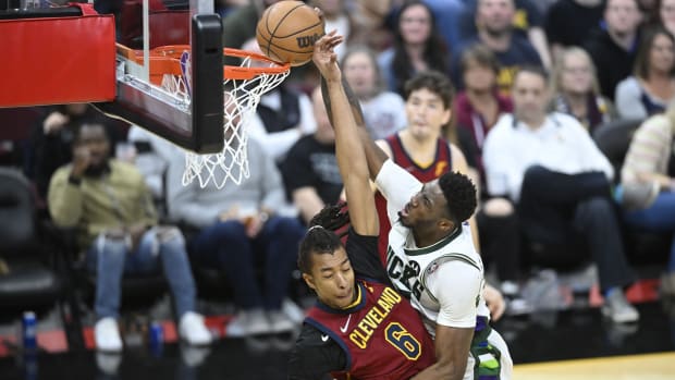 Milwaukee Bucks forward Thanasis Antetokounmpo (43) drives to the basket beside Cleveland Cavaliers center Moses Brown (6)