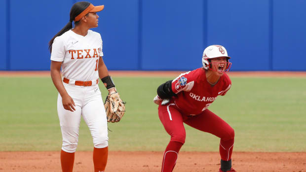 Oklahoma’s Jayda Coleman celebrates after reaching second base during a Women’s College World Series game vs. Texas