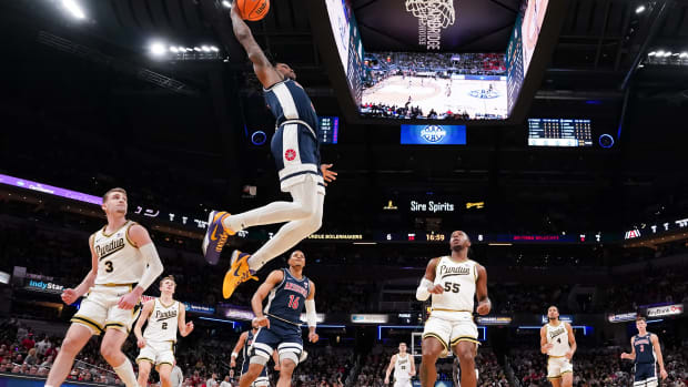 Arizona Wildcats guard Caleb Love goes up for a dunk against the Purdue Boilermakers.