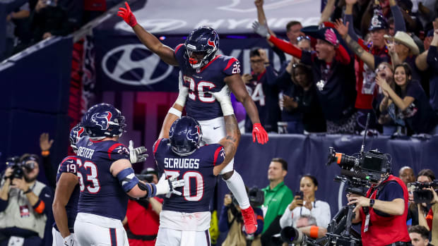 Texans running back Devin Singletary (26) celebrates scoring a touchdown during the fourth quarter in a 2024 AFC wild card game at NRG Stadium.
