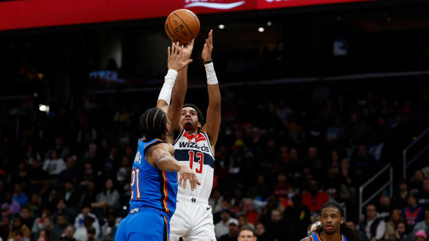 Washington Wizards guard Jordan Poole (13) shoots the ball over Oklahoma City Thunder guard Aaron Wiggins (21) in the third quarter at Capital One Arena.