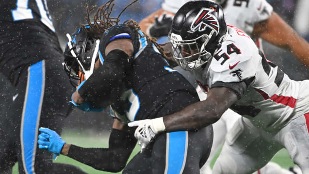 Carolina Panthers running back D'Onta Foreman (33) is tackled by Atlanta Falcons linebacker Rashaan Evans (54) in the fourth quarter at Bank of America Stadium on Nov. 10, 2022