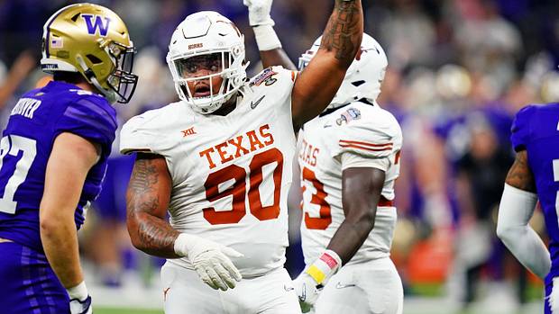 Longhorns defensive lineman Byron Murphy II (90) celebrates after a play during the second quarter in the 2024 Sugar Bowl college football playoff semifinal game at Caesars Superdome.