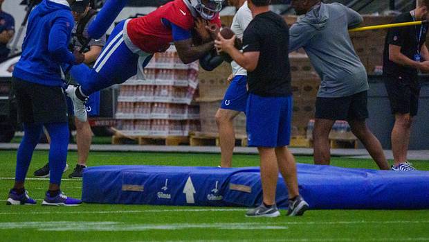 Indianapolis Colts quarterback Anthony Richardson (5) takes a leap Friday, July 28, 2023, during an indoor practice at Grand Park Sports Campus in Westfield, Indiana.