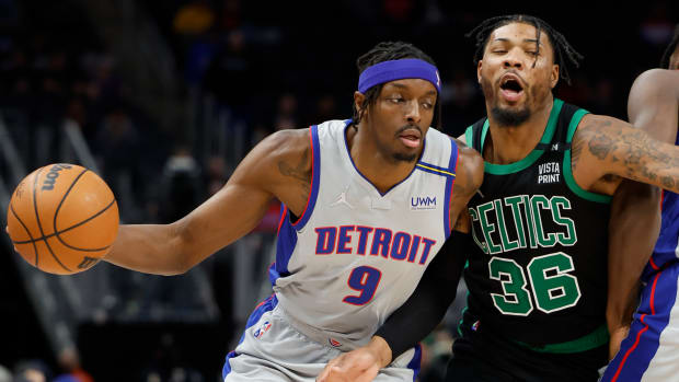 Feb 4, 2022; Detroit, Michigan, USA; Detroit Pistons forward Jerami Grant (9) dribbles defended by Boston Celtics guard Marcus Smart (36) in the first half at Little Caesars Arena.