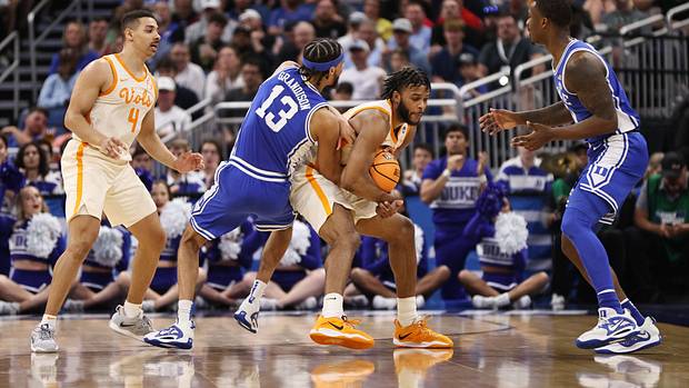 Tennessee Volunteers guard Josiah-Jordan James wrestles for the ball with Duke Blue Devils guard Jacob Grandison.