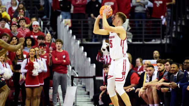 Wisconsin forward Tyler Wahl shooting a three-pointer against Maryland at the Kohl Center.