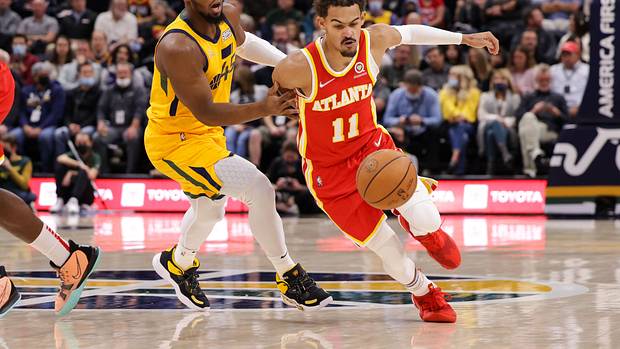 Atlanta Hawks guard Trae Young (11) tries to dribble away from Utah Jazz guard Donovan Mitchell (45) during the first quarter at Vivint Arena.