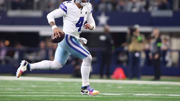 Dallas Cowboys quarterback Dak Prescott runs with the ball against the Seattle Seahawks.