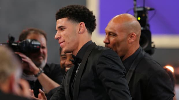 Jun 22, 2017; Brooklyn, NY, USA; Lonzo Ball (UCLA) celebrates with his father LaVar Ball after being introduced as the number two overall pick to the Los Angeles Lakers in the first round of the 2017 NBA Draft at Barclays Center.