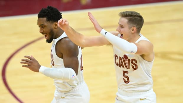Dec 18, 2023; Cleveland, Ohio, USA; Cleveland Cavaliers guard Donovan Mitchell (45) and guard Sam Merrill (5) celebrate in overtime against the Houston Rockets at Rocket Mortgage FieldHouse.