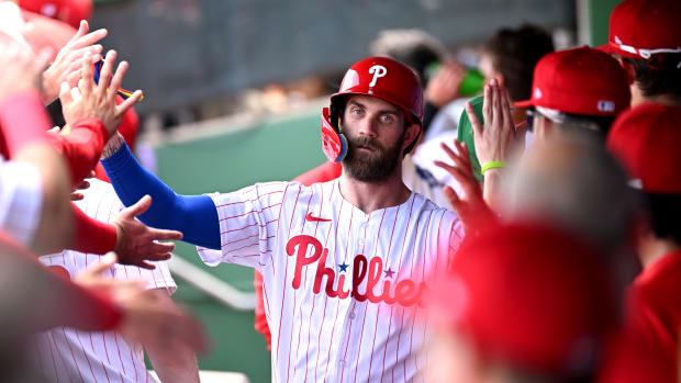 Mar 8, 2024; Clearwater, Florida, USA; Philadelphia Phillies first baseman Bryce Harper (3) celebrates with his teammates after scoring a run in the first inning of the spring training game against the Houston Astros at BayCare Ballpark.