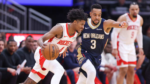Rockets guard Jalen Green drives with the ball as New Orleans Pelicans guard CJ McCollum defends during the second quarter at Toyota Center.