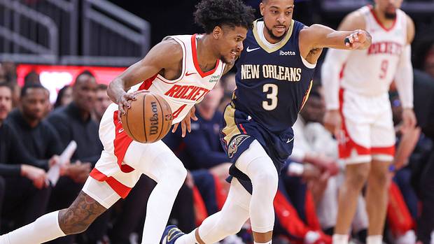 Rockets guard Jalen Green drives with the ball as New Orleans Pelicans guard CJ McCollum defends during the second quarter at Toyota Center.