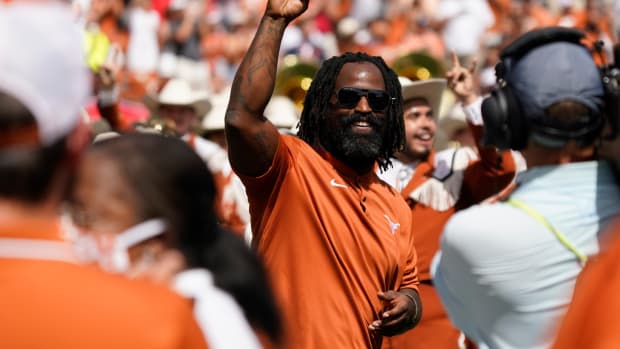 Ricky Williams waves to fans before a Texas Longhorns football game.