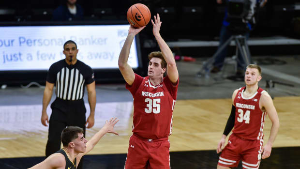 Wisconsin forward Nate Reuvers shooting a jump shot against Iowa (Credit: Jeffrey Becker-USA TODAY Sports)