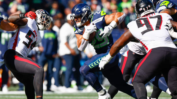 Seattle Seahawks running back Travis Homer (25) rushes against the Atlanta Falcons during the first quarter at Lumen Field.