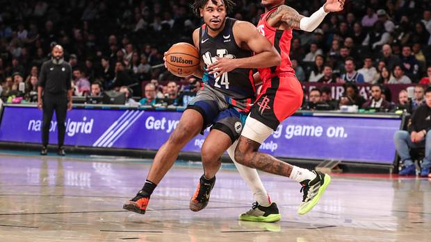 Nets guard Cam Thomas drives past Houston Rockets guard Jalen Green (4) in the second quarter at Barclays Center.