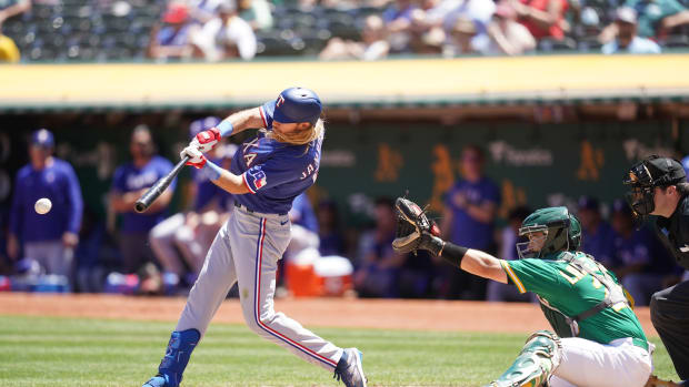 Texas Rangers left fielder Travis Jankowski, seen here hitting a single against the Athletics at Oakland Coliseum in 2023, said he's fine resuming his bench role from 2023.